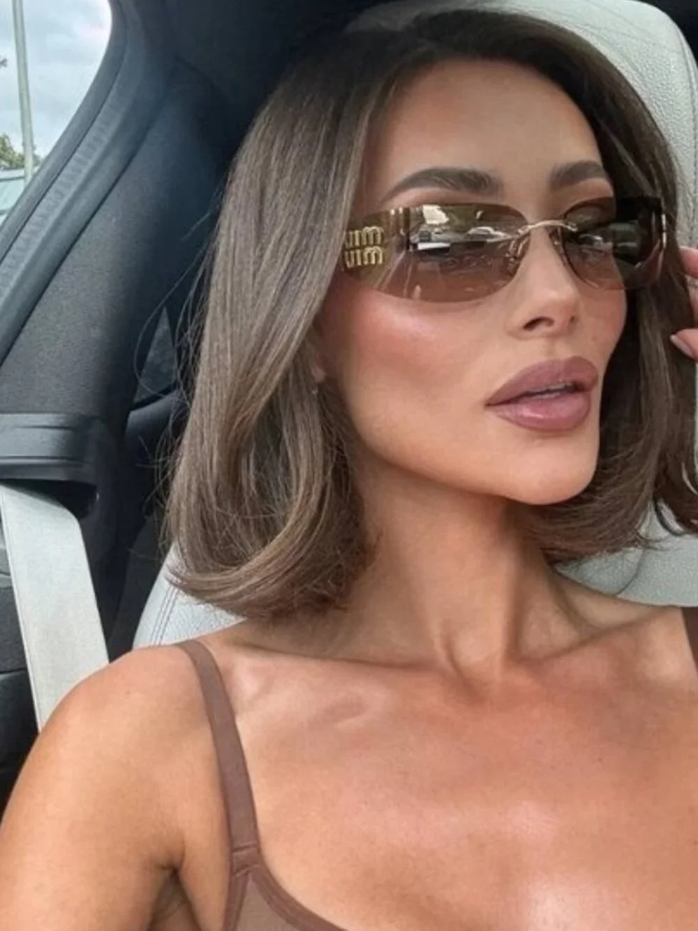 Miu Miu MUA51S 5AK20P Sunglasses Gold Rectangle Frame, Bronze Mirror Lenses